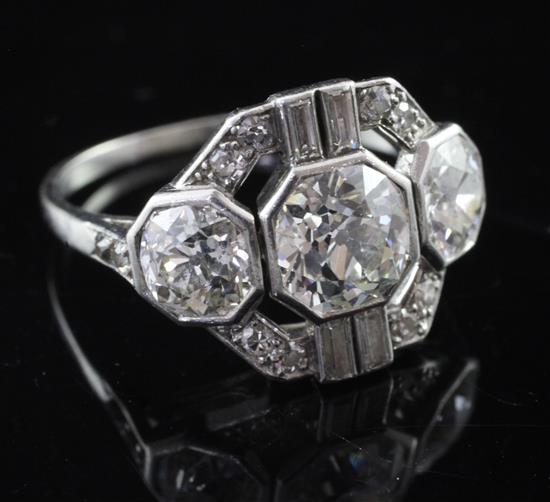 An attractive 1930s Art Deco platinum and diamond cluster dress ring, size P.